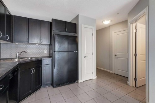 2704-211 13 Avenue Se, Calgary, AB - Indoor Photo Showing Kitchen With Double Sink