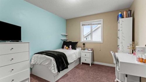 153 Heritage Bay, Cochrane, AB - Indoor Photo Showing Bedroom