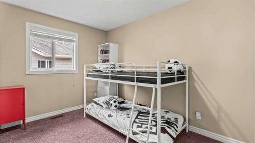 153 Heritage Bay, Cochrane, AB - Indoor Photo Showing Bedroom