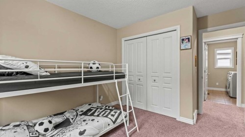 153 Heritage Bay, Cochrane, AB - Indoor Photo Showing Bedroom