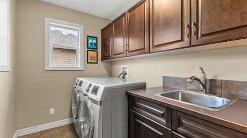 153 Heritage Bay, Cochrane, AB - Indoor Photo Showing Laundry Room