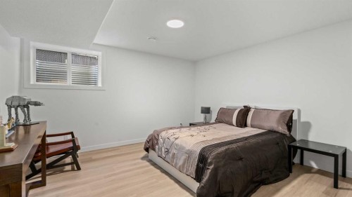 153 Heritage Bay, Cochrane, AB - Indoor Photo Showing Bedroom
