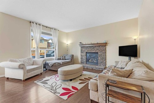883 Auburn Bay Boulevard Se, Calgary, AB - Indoor Photo Showing Living Room With Fireplace
