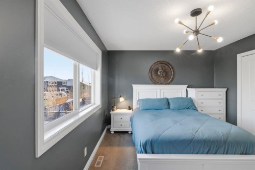 729 Hampton Hills Drive Ne, High River, AB - Indoor Photo Showing Bedroom