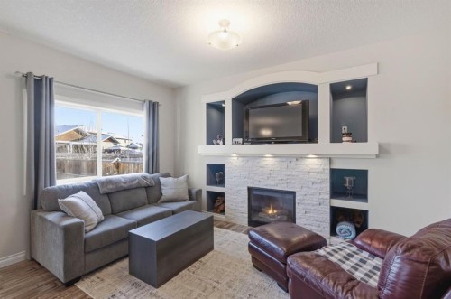 729 Hampton Hills Drive Ne, High River, AB - Indoor Photo Showing Living Room With Fireplace