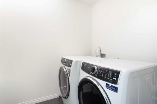 210 Auburn Bay Square Se, Calgary, AB - Indoor Photo Showing Laundry Room