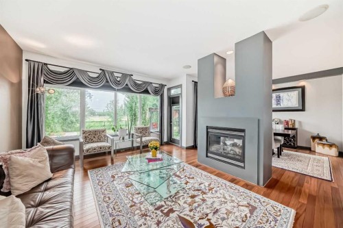 206 Tuscany Ravine Close Nw, Calgary, AB - Indoor Photo Showing Living Room With Fireplace