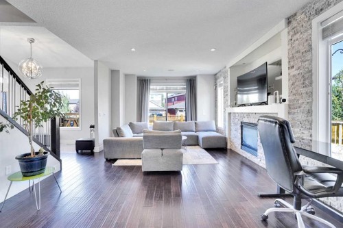172 Kinniburgh Way, Chestermere, AB - Indoor Photo Showing Living Room With Fireplace