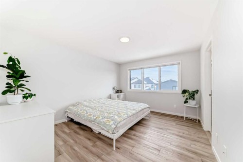 24 Royston Rise Nw, Calgary, AB - Indoor Photo Showing Bedroom