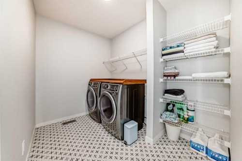 24 Royston Rise Nw, Calgary, AB - Indoor Photo Showing Laundry Room