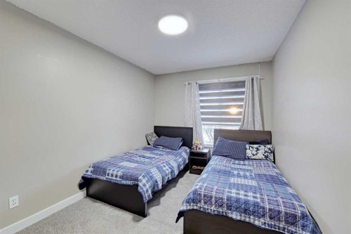 303 Saddlebrook Way Ne, Calgary, AB - Indoor Photo Showing Bedroom