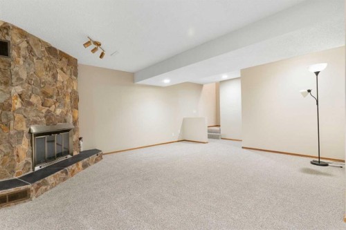 123 Glacier Drive Sw, Calgary, AB - Indoor With Fireplace