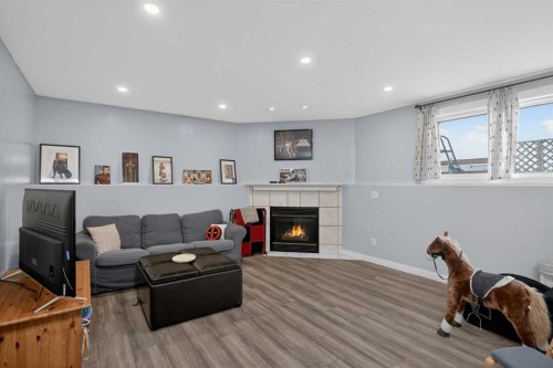 38 Canoe Circle Sw, Airdrie, AB - Indoor Photo Showing Living Room With Fireplace