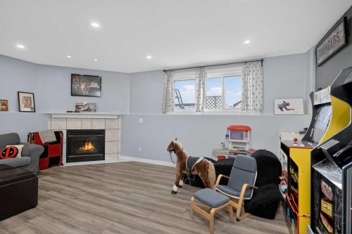 38 Canoe Circle Sw, Airdrie, AB - Indoor With Fireplace