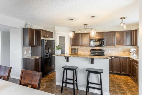 100 Silverado Plains View Sw, Calgary, AB - Indoor Photo Showing Kitchen With Upgraded Kitchen