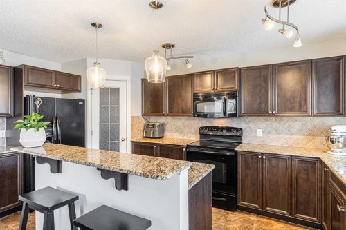 100 Silverado Plains View Sw, Calgary, AB - Indoor Photo Showing Kitchen With Upgraded Kitchen