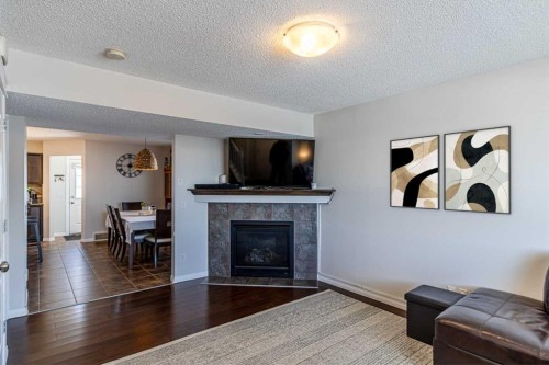 100 Silverado Plains View Sw, Calgary, AB - Indoor Photo Showing Living Room With Fireplace