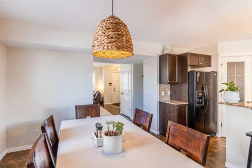 100 Silverado Plains View Sw, Calgary, AB - Indoor Photo Showing Dining Room