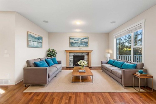 139 Coopers Hill Sw, Airdrie, AB - Indoor Photo Showing Living Room With Fireplace
