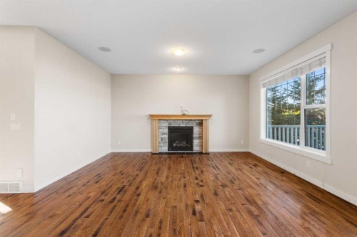 139 Coopers Hill Sw, Airdrie, AB - Indoor Photo Showing Living Room With Fireplace
