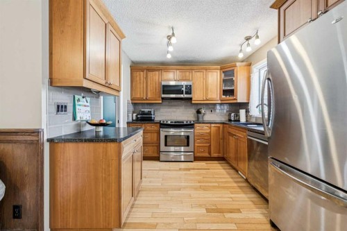 144 Waldron Avenue, Okotoks, AB - Indoor Photo Showing Kitchen With Stainless Steel Kitchen