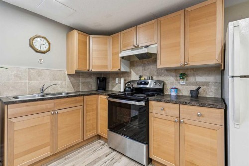144 Waldron Avenue, Okotoks, AB - Indoor Photo Showing Kitchen With Double Sink
