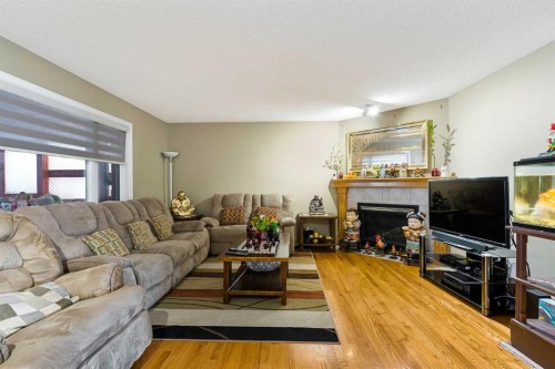 332 Harvest Hills Drive Ne, Calgary, AB - Indoor Photo Showing Living Room With Fireplace