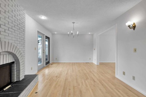 815 Woodpark Way Sw, Calgary, AB - Indoor With Fireplace