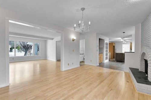 815 Woodpark Way Sw, Calgary, AB - Indoor With Fireplace