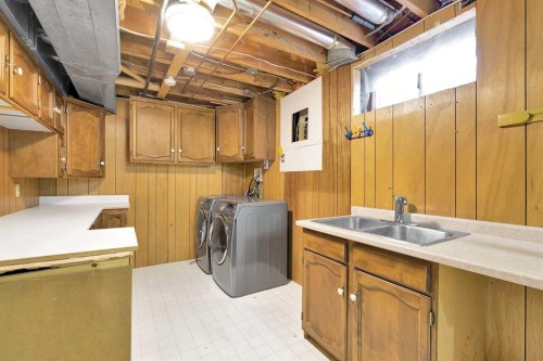 815 Woodpark Way Sw, Calgary, AB - Indoor Photo Showing Laundry Room