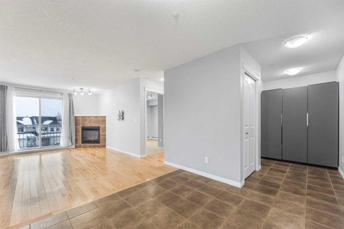 4313-31 Country Village Manor Ne, Calgary, AB - Indoor Photo Showing Living Room With Fireplace