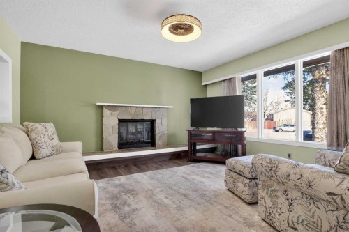 3204 Riel Place Se, Calgary, AB - Indoor Photo Showing Living Room With Fireplace