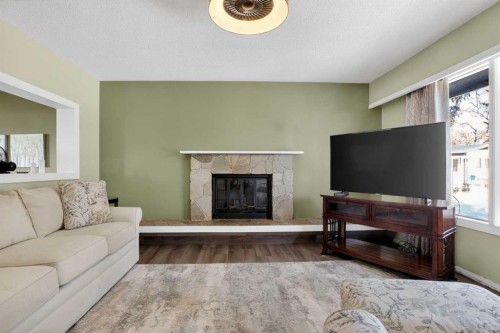 3204 Riel Place Se, Calgary, AB - Indoor Photo Showing Living Room With Fireplace