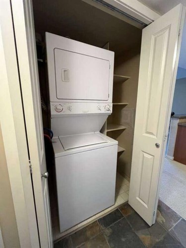 1205-1088 6 Avenue Sw, Calgary, AB - Indoor Photo Showing Laundry Room