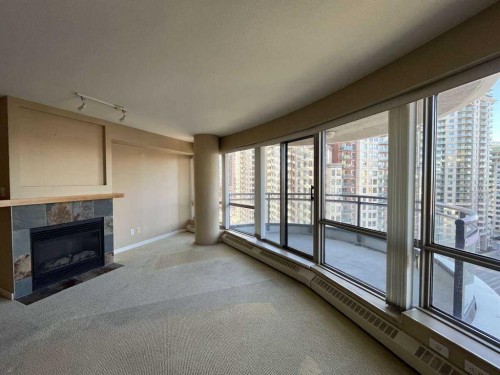 1205-1088 6 Avenue Sw, Calgary, AB - Indoor Photo Showing Other Room With Fireplace