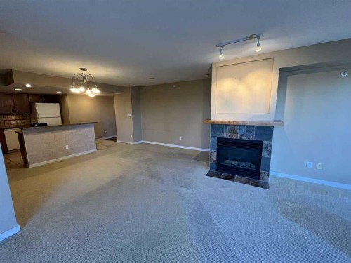 1205-1088 6 Avenue Sw, Calgary, AB - Indoor Photo Showing Other Room With Fireplace