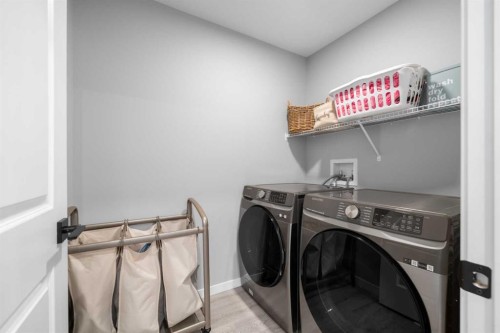 92 Wolf Gate, Okotoks, AB - Indoor Photo Showing Laundry Room