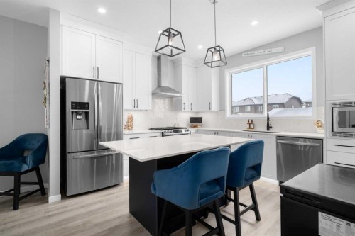 92 Wolf Gate, Okotoks, AB - Indoor Photo Showing Kitchen With Stainless Steel Kitchen With Upgraded Kitchen