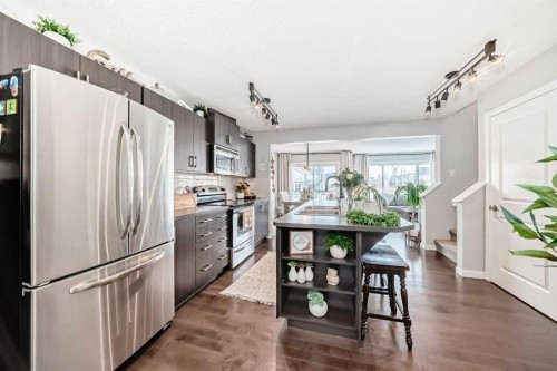 117 Sunset Common, Cochrane, AB - Indoor Photo Showing Kitchen With Stainless Steel Kitchen