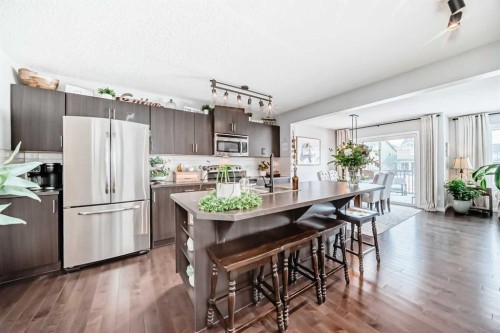 117 Sunset Common, Cochrane, AB - Indoor Photo Showing Kitchen With Stainless Steel Kitchen