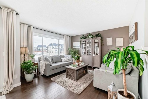 117 Sunset Common, Cochrane, AB - Indoor Photo Showing Living Room