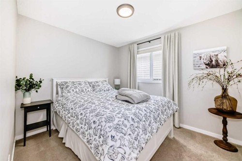 117 Sunset Common, Cochrane, AB - Indoor Photo Showing Bedroom
