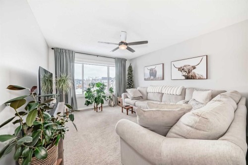 117 Sunset Common, Cochrane, AB - Indoor Photo Showing Living Room