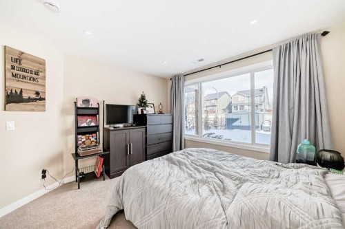 117 Sunset Common, Cochrane, AB - Indoor Photo Showing Bedroom
