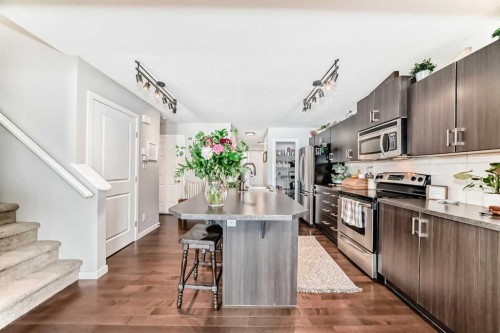 117 Sunset Common, Cochrane, AB - Indoor Photo Showing Kitchen With Upgraded Kitchen