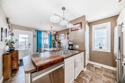 20 Mackenzie, Carstairs, AB - Indoor Photo Showing Kitchen With Double Sink