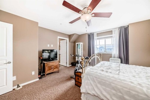 20 Mackenzie, Carstairs, AB - Indoor Photo Showing Bedroom