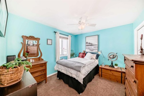 20 Mackenzie, Carstairs, AB - Indoor Photo Showing Bedroom