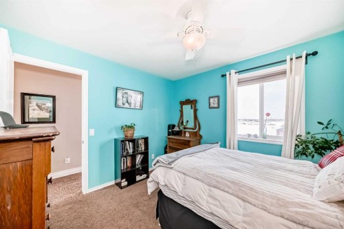 20 Mackenzie, Carstairs, AB - Indoor Photo Showing Bedroom
