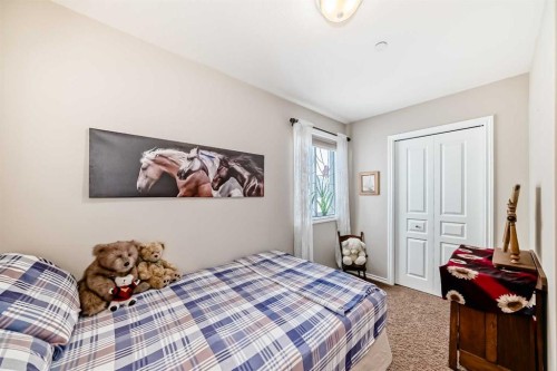 20 Mackenzie, Carstairs, AB - Indoor Photo Showing Bedroom